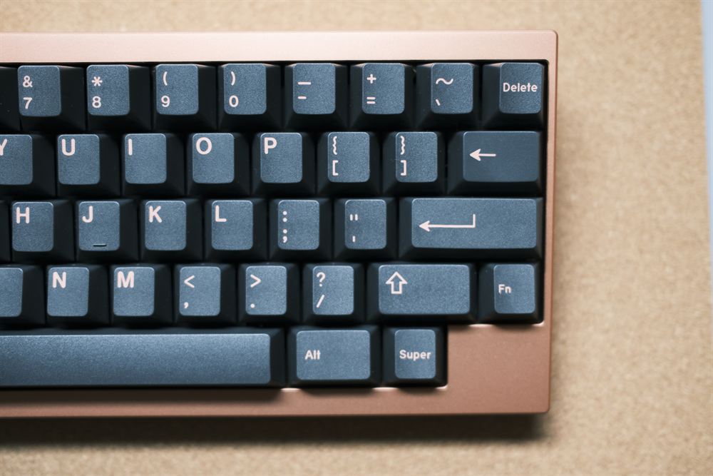 Close-up of the right cluster keycaps against the coral case