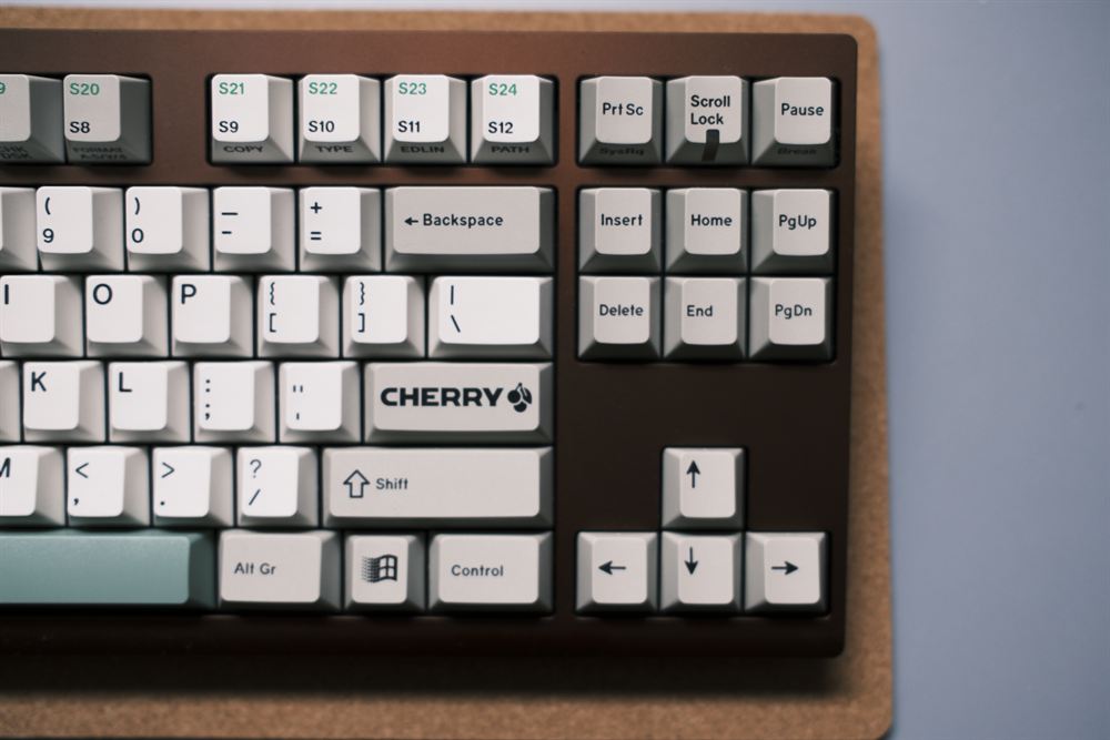 Right side showing the Cherry logo keycap and navigation cluster