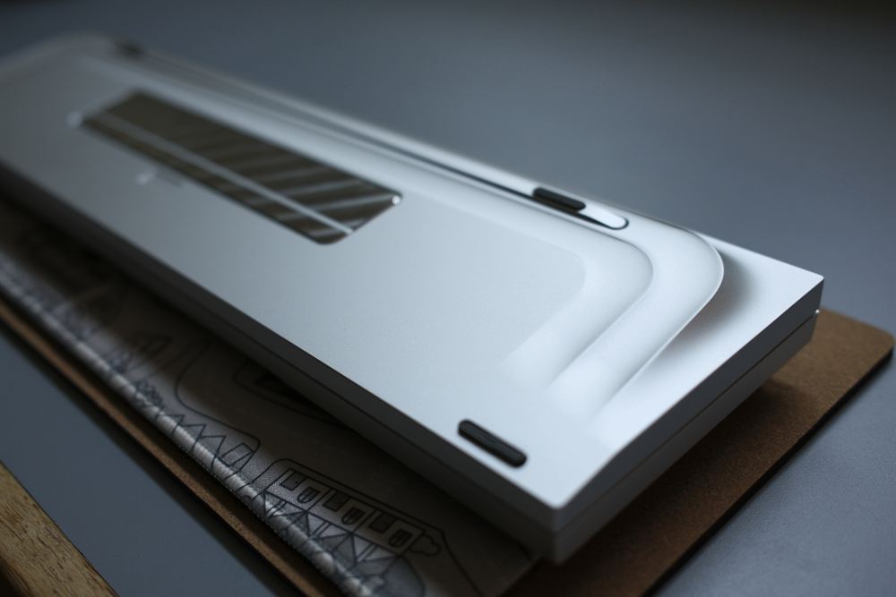 INN FloAT — silver anodized board with navy GMK Striker 2