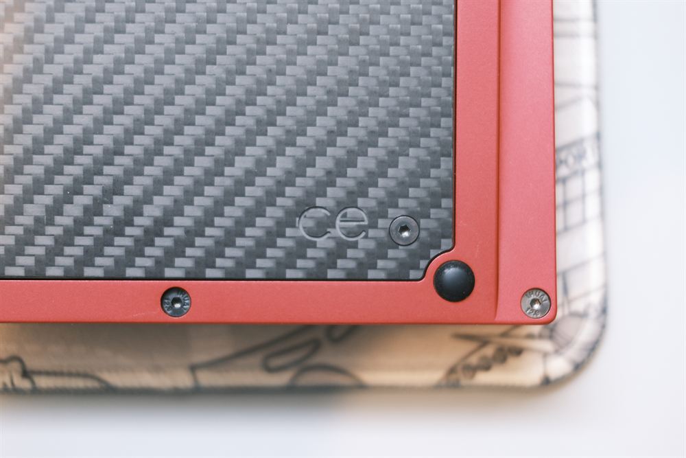 Underside corner showing the carbon-fibre weight with ce marking