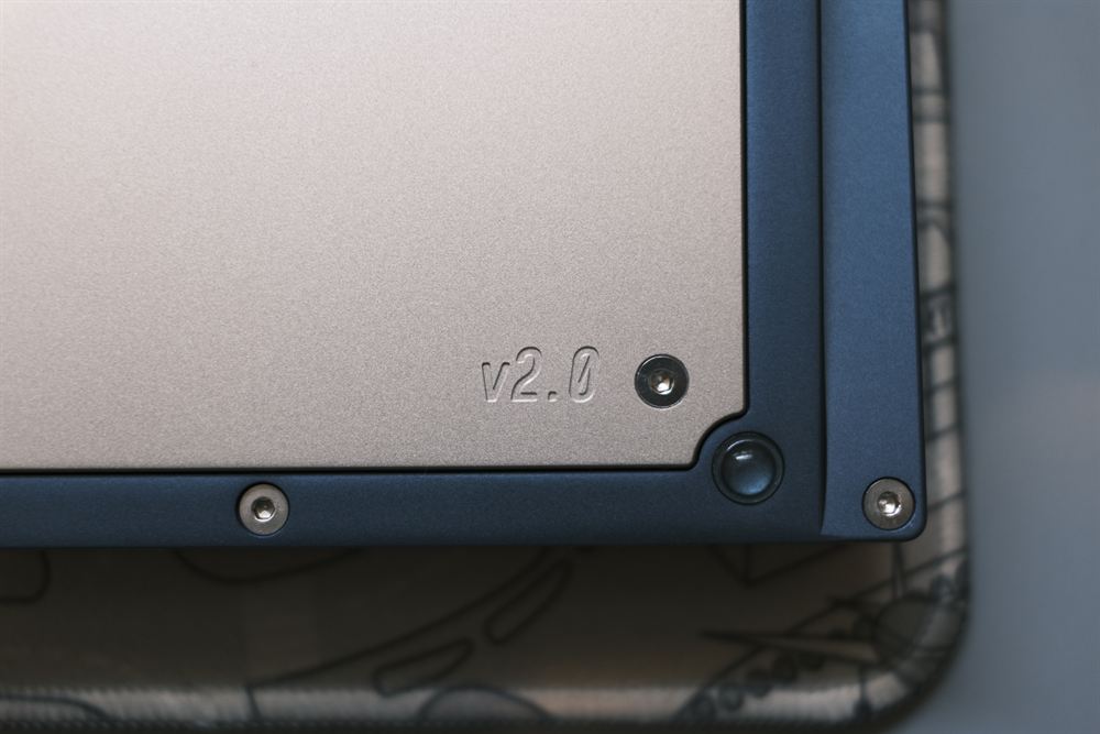 Rear corner close-up of the engraved v2.0 marking
