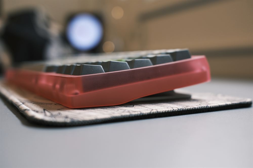 Low side profile of the pink case with bokeh background