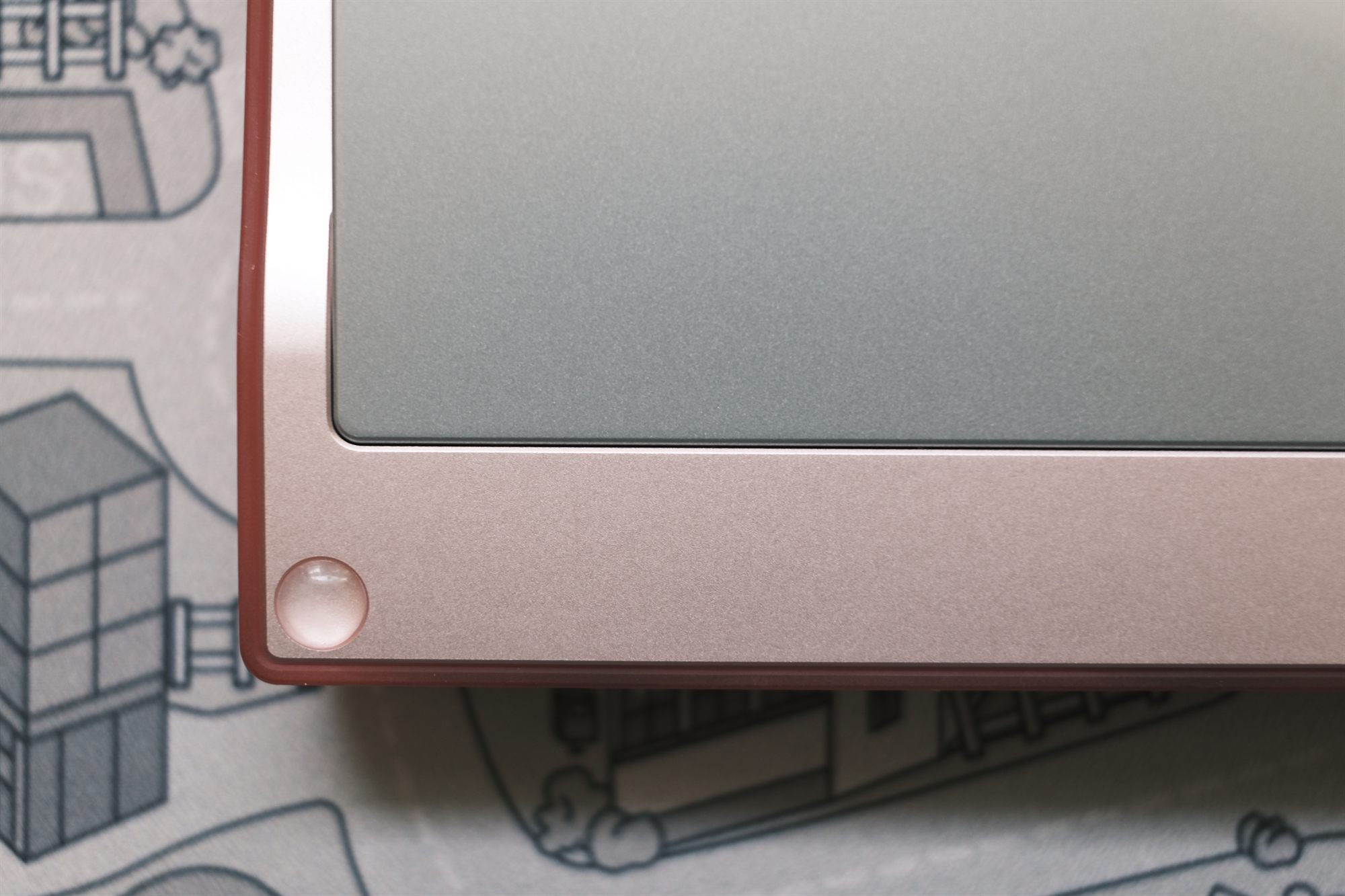 Bowl x Alexotos Manta, corner detail — frosted pink polycarbonate case with brushed top plate and rose-gold trim