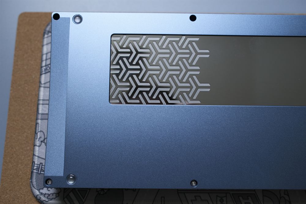 Close-up of the blue weight with hex-pattern engraving