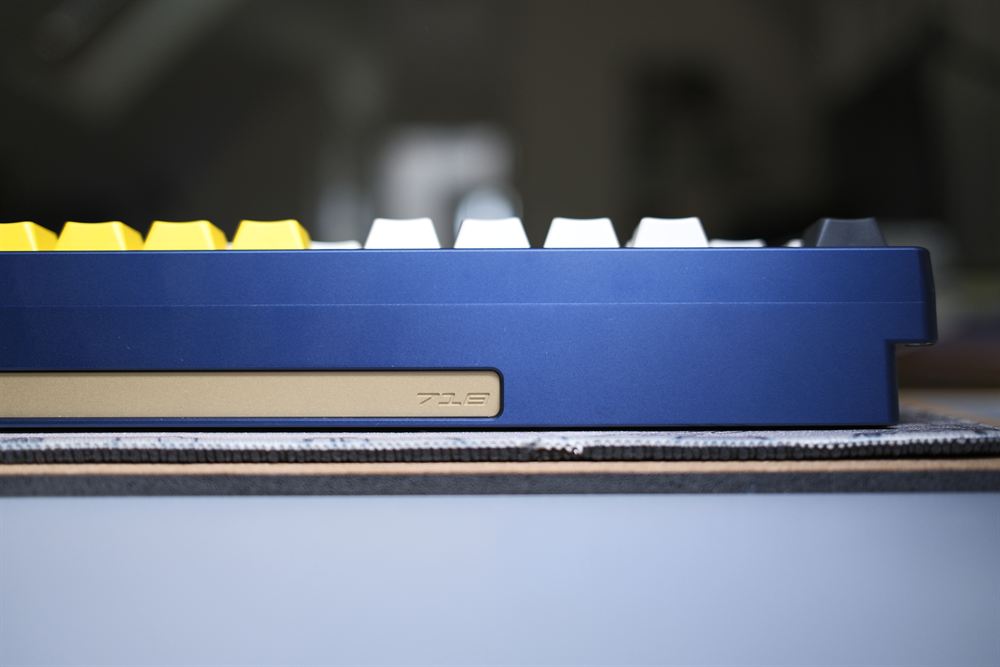 Side profile of the blue case with the gold 7XS badge