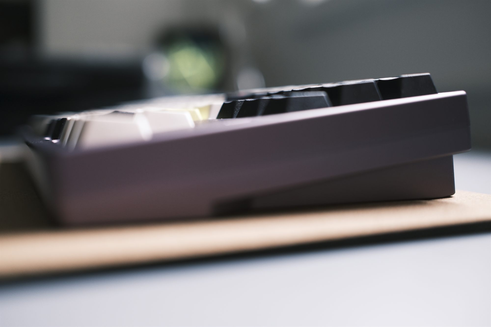 Plywrks Spyder, three-quarter view — deep purple anodized case with GMK Future Funk keycaps