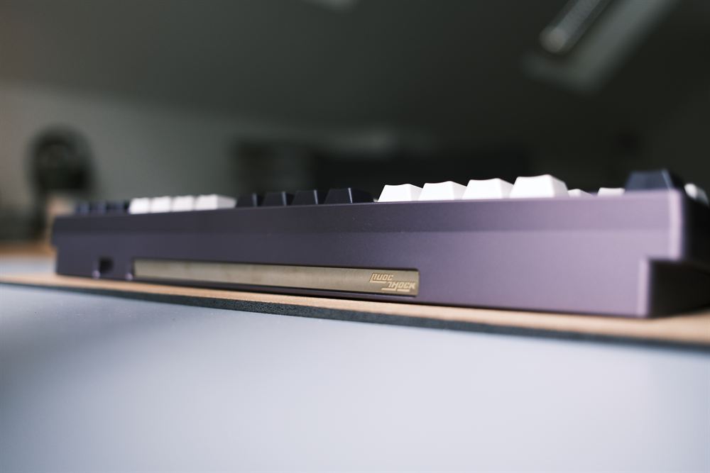 Rear profile of the purple case with the QuocShock badge