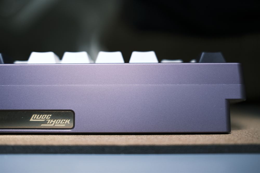 Side profile macro showing the QuocShock badge on the case