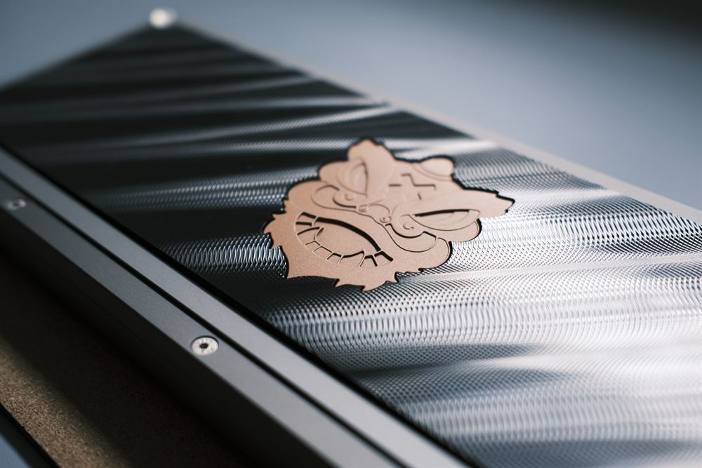 Angled view of the stainless backplate, machine marks catching the light